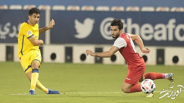 گونزالو مارتینز از النصر مقابل سیامک نعمتی از پرسپولیس ANADOLU AGENCY